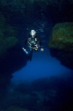 Diver entering sea cave. Diver entering sea cave.