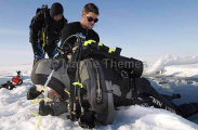 Divers preparing to enter crack or lead in sea ice. Divers preparing to enter crack or lead in sea ice.