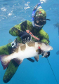 Spearfisher with Blacksaddled Coralgrouper (Plectropomus laevis) Spearfisher with Blacksaddled Coralgrouper (Plectropomus laevis)