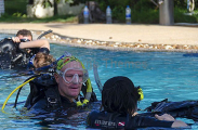 Dive instructor with student in resort swimming pool. Dive instructor with student in resort swimming pool.