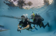 Diver and instructor learning "no mask" diving, used to train divers to deal with a faulty, broken or missing mask.