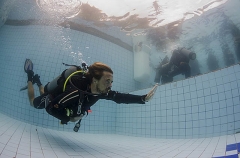 Diver demonstrating "no mask" diving, used to train divers to deal with a faulty, broken or missing mask. Diver demonstrating "no mask" diving, used to train divers to deal with a faulty, broken or missing mask.