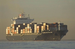 Container ship at sea at dusk. Container ship at sea at dusk.