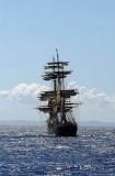 Stern view of schooner at sea. Stern view of schooner at sea.