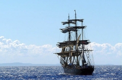 Schooner at sea with sails furled. Schooner at sea with sails furled.