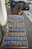 Sardines drying on racks outside Japanese fish shop. Sardines drying on racks outside Japanese fish shop.