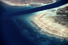Aerials of coral island beach meeting coral reef and ocean with lagoon channel. Aerials of coral island beach meeting coral reef and ocean with lagoon channel.
