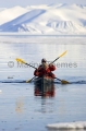 Sea Kayak in calm waters off floe edge of sea ice. Sea Kayak in calm waters off floe edge of sea ice.
