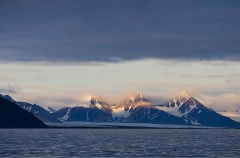 Snow capped mountains on edge of ocean. Snow capped mountains on edge of ocean.