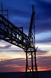 Offshore oil rig burn off tower at dusk. Offshore oil rig burn off tower at dusk.
