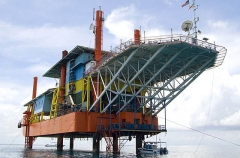 Oil rig in calm inshore waters. Oil rig in calm inshore waters.