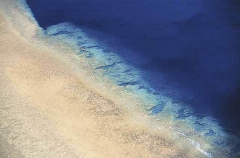 Aerial of coral island with coral reef and sandy beach. Aerial of coral island with coral reef and sandy beach.
