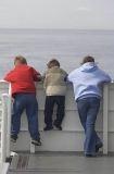 Children looking over railing on board ferry. Children looking over railing on board ferry.