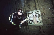 Diver with Lady And The Unicorn figurine in the main saloon area of the President Coolidge shipwreck. Diver with Lady And The Unicorn figurine in the main saloon area of the President Coolidge shipwreck.