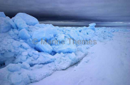 Blocks of sea ice at dusk pushed up by pressure from wind and tides. Blocks of sea ice at dusk pushed up by pressure from wind and tides.