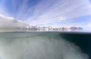 Split shot of sea ice floe edge.
