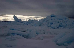 Blocks of sea ice at dusk pushed up by pressure from wind and tides. Blocks of sea ice at dusk pushed up by pressure from wind and tides.