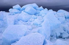 Blocks of sea ice at dusk pushed up by pressure from wind and tides. Blocks of sea ice at dusk pushed up by pressure from wind and tides.