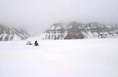 Skidoo and Kamotik or sled travelling across sea ice.