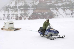 Skidoo and Kamotik or sled travelling across sea ice.
