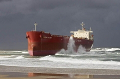 Bulk carrier grounded on beach during severe storm. Bulk carrier grounded on beach during severe storm.
