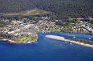 Township at mouth of estuary with sand spit. Township at mouth of estuary with sand spit.