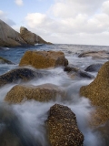 Rocky shore with granite boulders and waves. Rocky shore with granite boulders and waves.