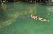 Snorkel diver over wreck of Japanese sea plane from World War II. Snorkel diver over wreck of Japanese sea plane from World War II.