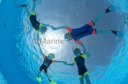 Young girls learning to use snorkel equipment. Young girls learning to use snorkel equipment.