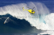 A helicopter filming a tow-in surfer at Peahi (Jaws) A helicopter filming a tow-in surfer at Peahi (Jaws)