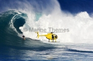 A helicopter filming a tow-in surfer at Peahi (Jaws)