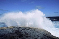 Waves crashing against rocks. Waves crashing against rocks.