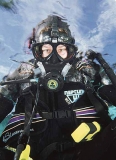Commercial diver with full face mask.