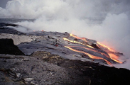 Lava erupting from volcanic vent and flowing into the ocean. Lava erupting from volcanic vent and flowing into the ocean.
