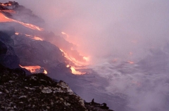 Lava erupting from volcanic vent and flowing into the ocean. Lava erupting from volcanic vent and flowing into the ocean.
