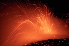 Lava erupting from vent on sea shore. Lava erupting from vent on sea shore.
