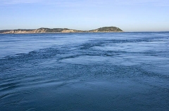 Surface eddys showing rip tide action.