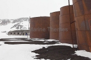 Storage tanks and barracks at abandoned whaling station. Storage tanks and barracks at abandoned whaling station.